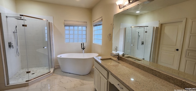 bathroom featuring vanity, independent shower and bath, and tile patterned floors