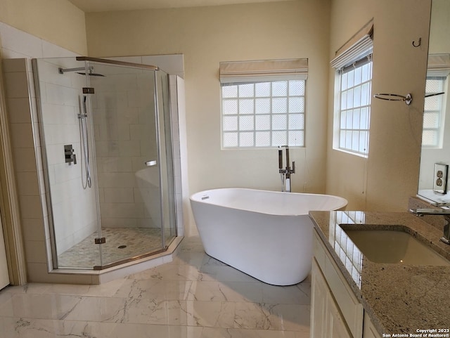 bathroom featuring independent shower and bath, vanity, and tile patterned flooring