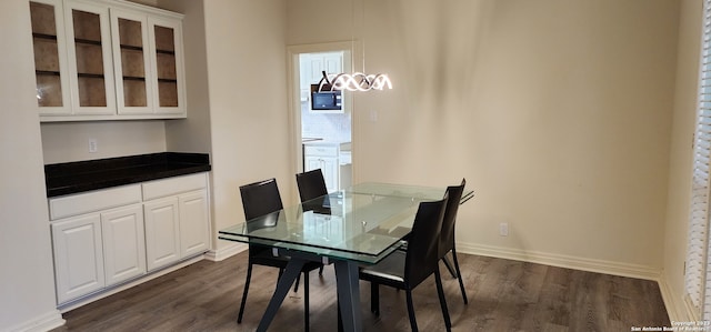 dining room featuring dark wood-type flooring