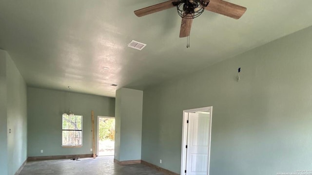 empty room featuring concrete flooring and ceiling fan