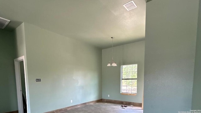 empty room with a notable chandelier