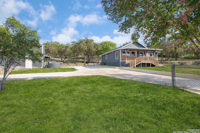 view of front of home with a front yard and a porch