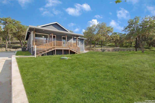 view of front of house featuring a front yard and covered porch