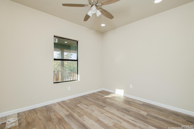 empty room featuring ceiling fan and light wood-type flooring