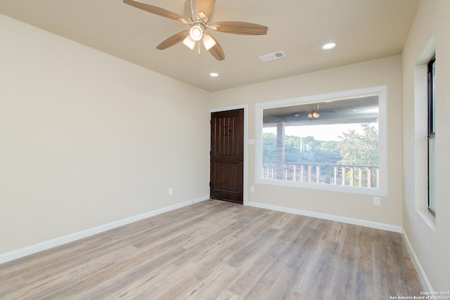 unfurnished room featuring ceiling fan and light hardwood / wood-style floors