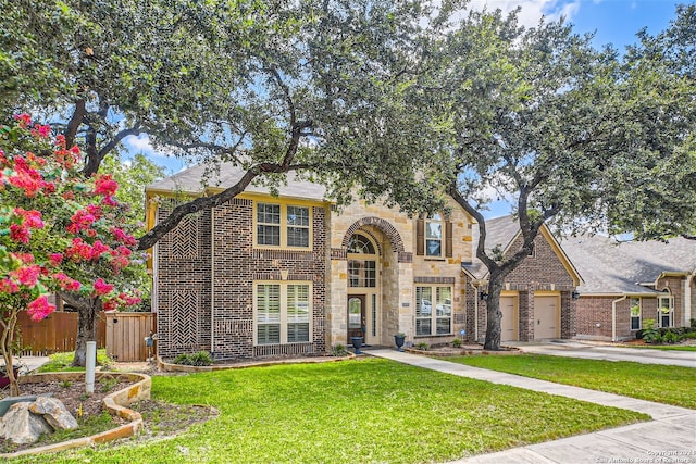 view of front facade featuring a garage and a front yard