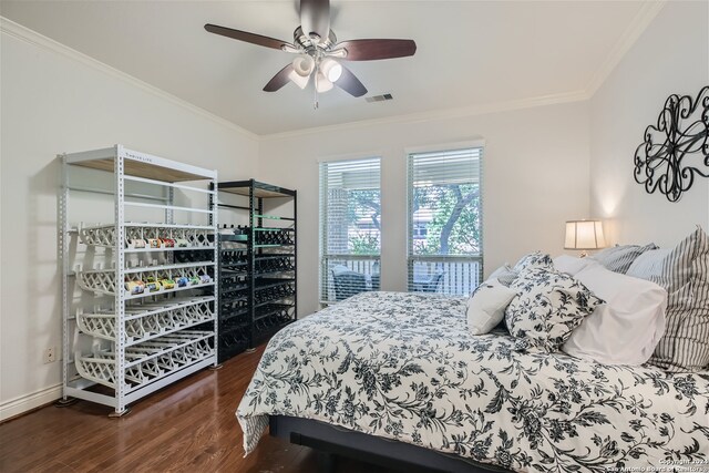 bedroom with wood-type flooring, ceiling fan, and crown molding