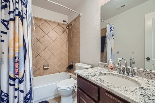 full bathroom with vanity, toilet, and shower / bath combo