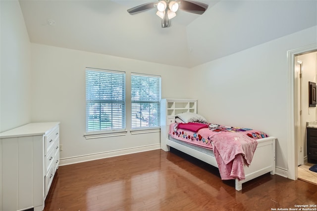 bedroom featuring lofted ceiling, dark wood-type flooring, ceiling fan, and connected bathroom