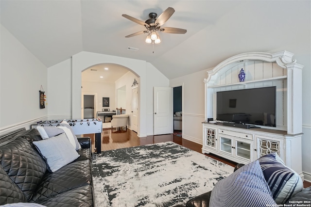 living room featuring vaulted ceiling, ceiling fan, and hardwood / wood-style floors