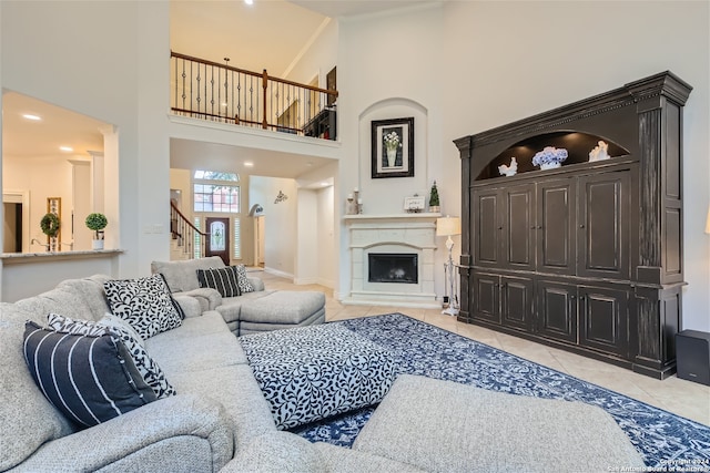 living room featuring light tile patterned floors and a high ceiling