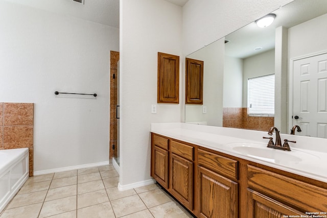 bathroom featuring tile patterned floors, vanity, and independent shower and bath