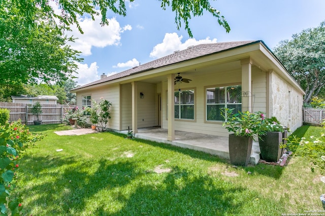 rear view of house with a lawn, a patio area, and ceiling fan