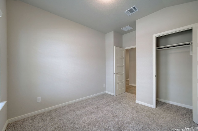 25776 Rosey Way, Boerne, TX 78006 - unfurnished bedroom featuring light colored carpet, a closet, and baseboards