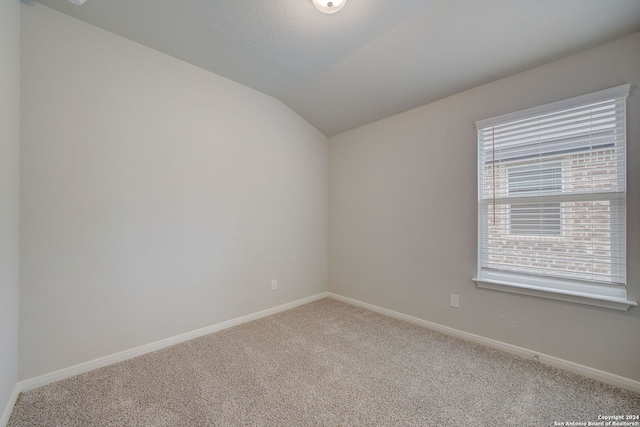 25776 Rosey Way, Boerne, TX 78006 - carpeted spare room with lofted ceiling and baseboards