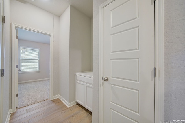 hall with light hardwood / wood-style floors