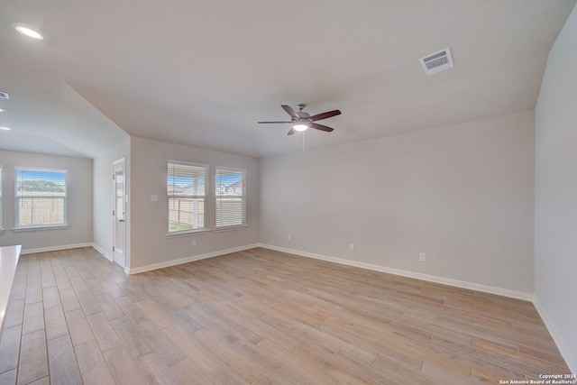 spare room featuring light hardwood / wood-style floors and ceiling fan