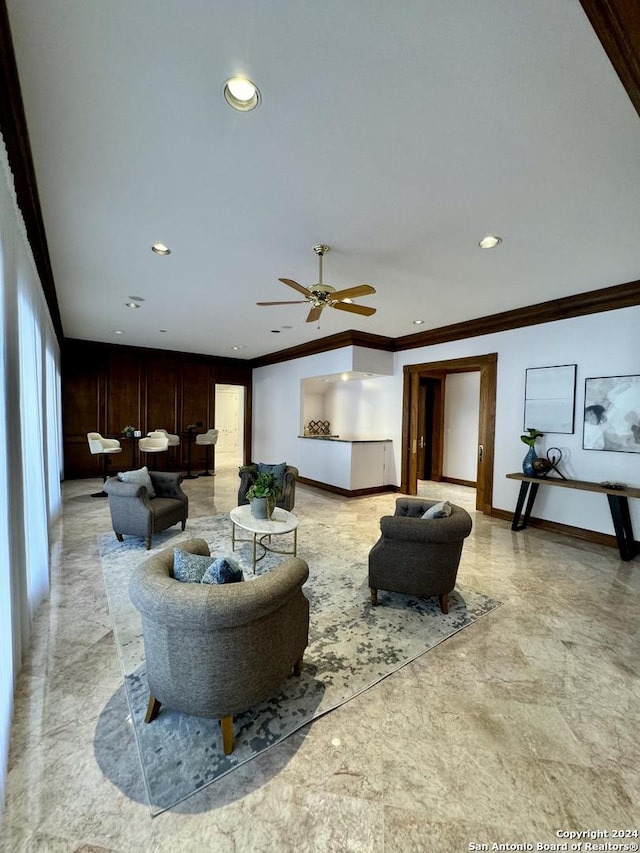 living room with crown molding and ceiling fan