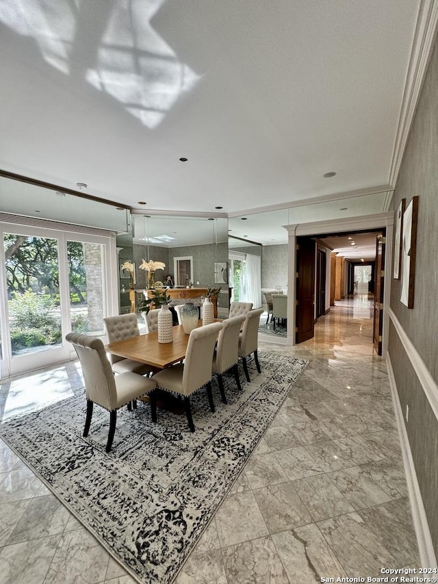 dining room featuring crown molding