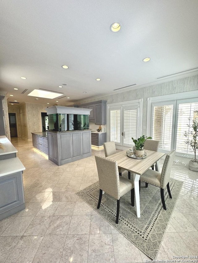 dining area featuring crown molding and french doors