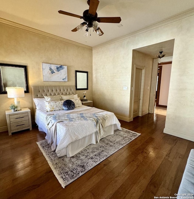 bedroom featuring ornamental molding, ceiling fan, and dark hardwood / wood-style flooring