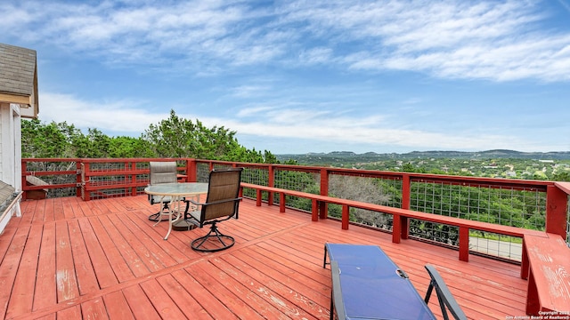 wooden deck with a mountain view