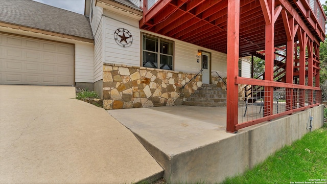 view of exterior entry featuring a garage