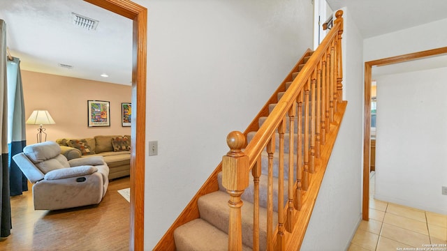 staircase with tile patterned flooring