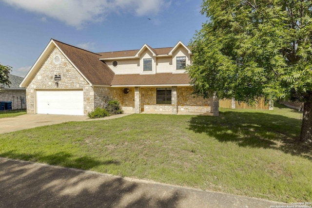 view of front of house featuring a front yard and a garage