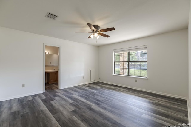 empty room with ceiling fan and dark wood-type flooring