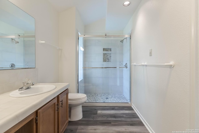 bathroom featuring vaulted ceiling, decorative backsplash, hardwood / wood-style flooring, and an enclosed shower