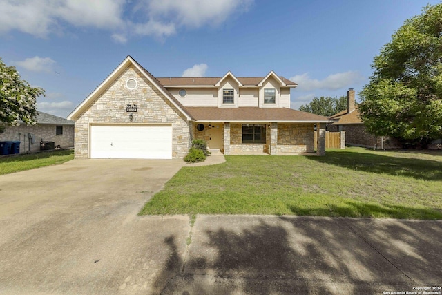 view of front of house featuring a garage and a front lawn