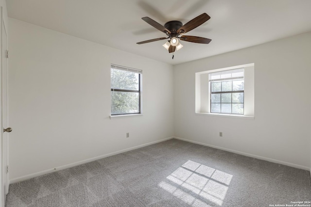 empty room with carpet and ceiling fan