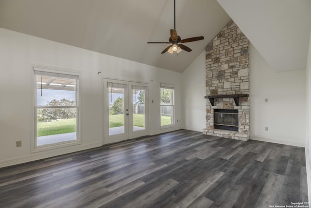 unfurnished living room featuring high vaulted ceiling, dark hardwood / wood-style flooring, ceiling fan, and a fireplace