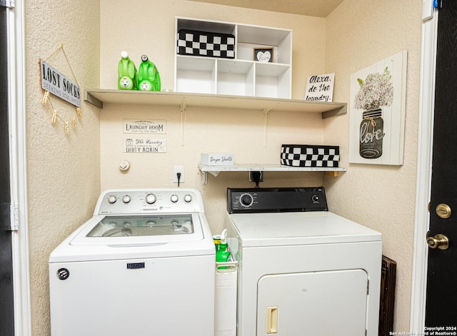 washroom featuring washer and clothes dryer