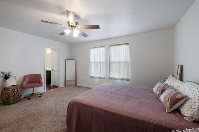 carpeted bedroom with ceiling fan and ensuite bathroom