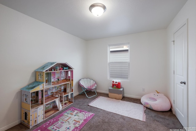 game room with dark carpet