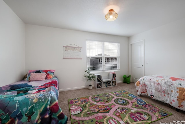 bedroom featuring light colored carpet