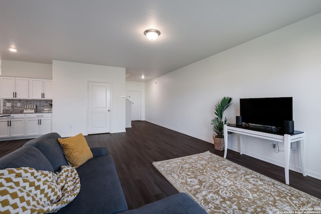 living room with dark hardwood / wood-style floors