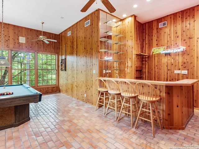 recreation room featuring wooden walls, ceiling fan, and pool table