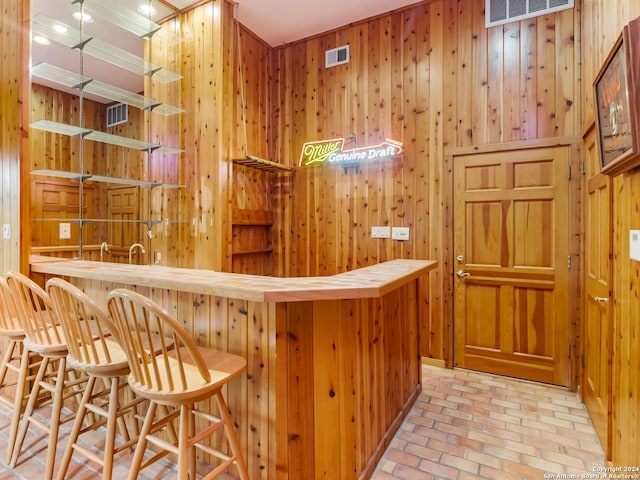 bar featuring wooden walls