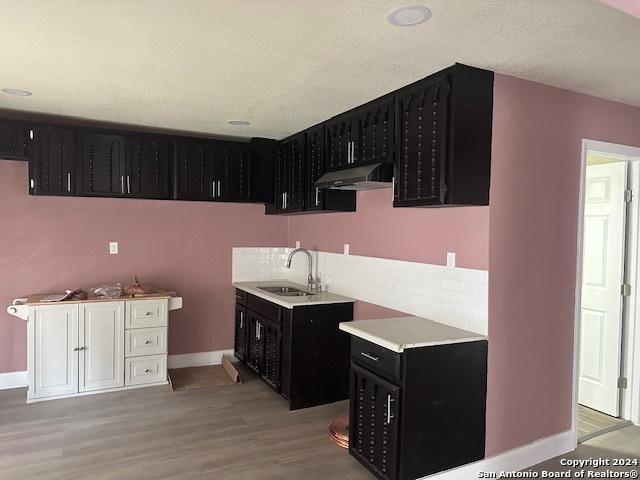 kitchen featuring sink and light hardwood / wood-style flooring