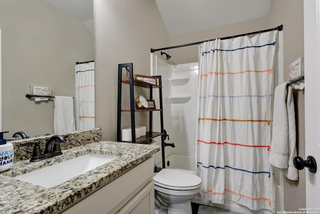 full bathroom featuring shower / bath combo with shower curtain, vanity, and toilet