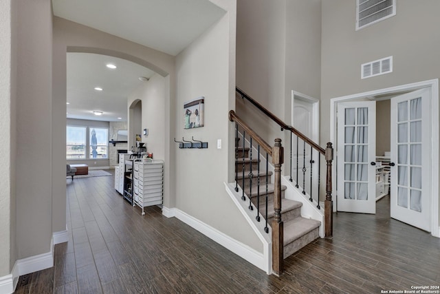 stairs with french doors