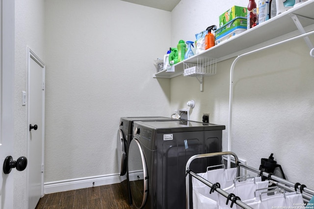 laundry area with separate washer and dryer and dark wood-type flooring