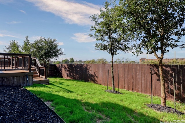 view of yard featuring a wooden deck