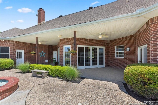 rear view of property featuring french doors and a patio