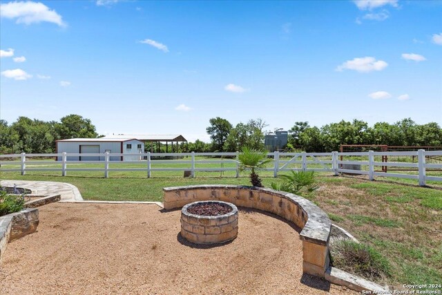 view of yard with a rural view