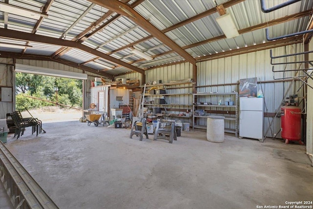 garage with white refrigerator