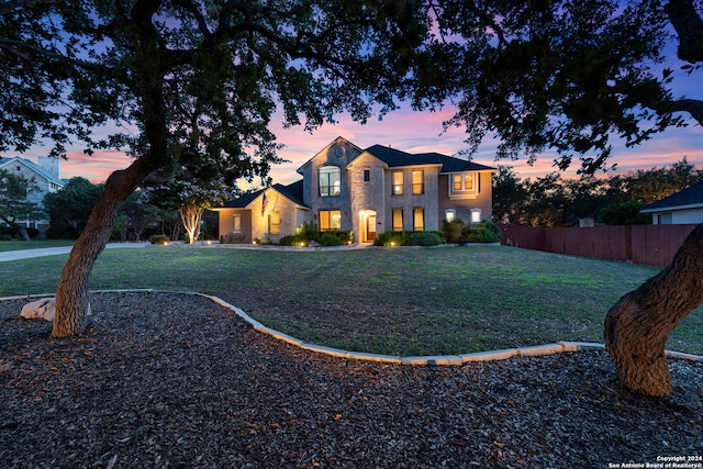 view of front of property with a lawn